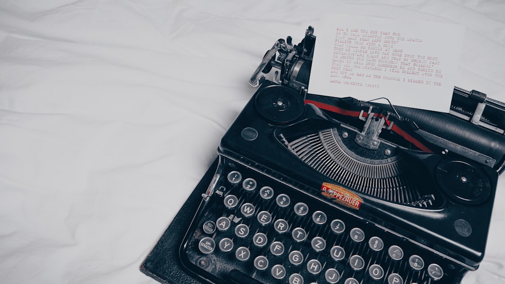 black typewriter on white textile