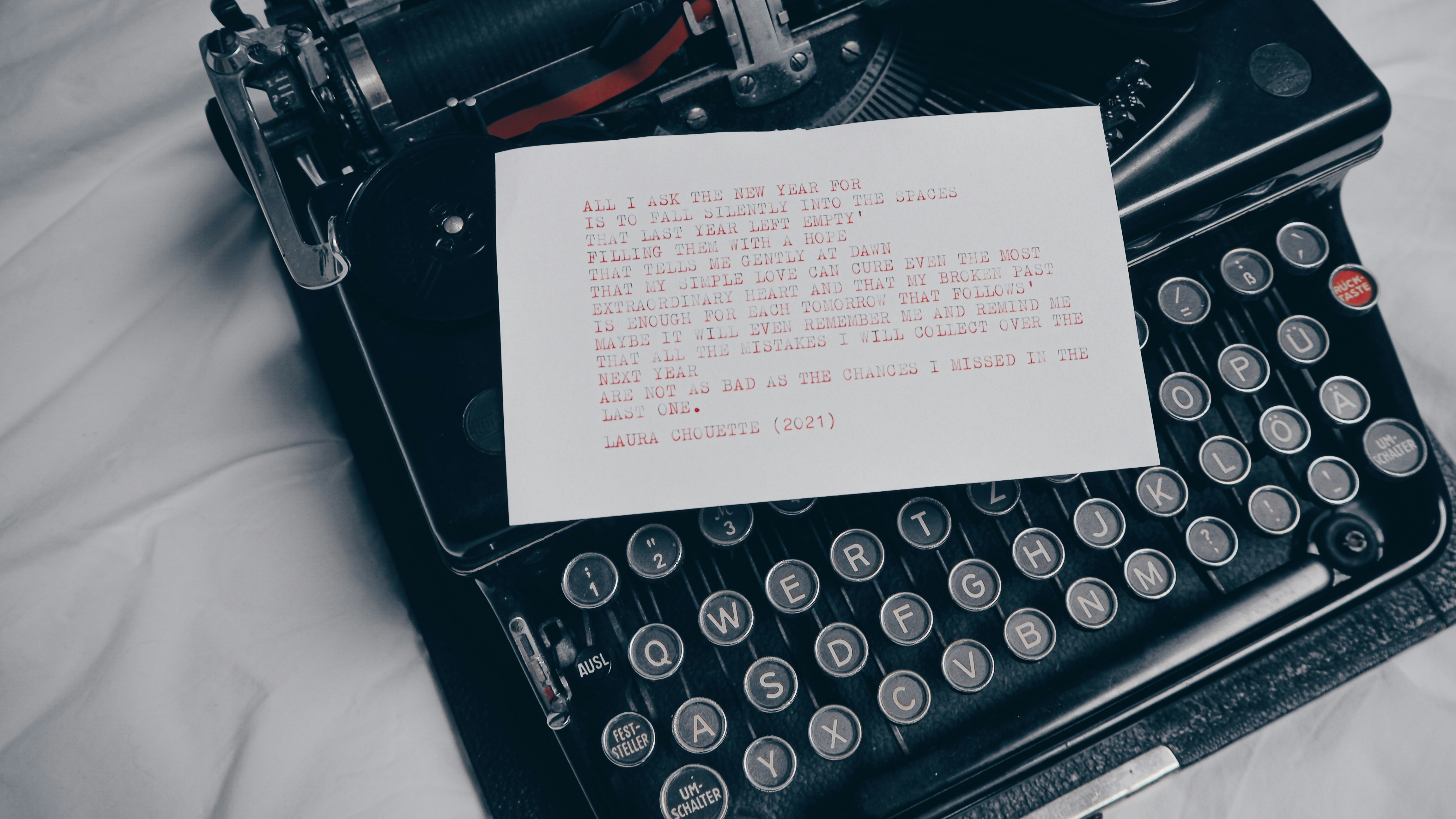 white printer paper on black typewriter