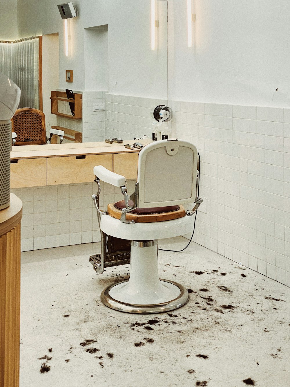 white and brown barber chair