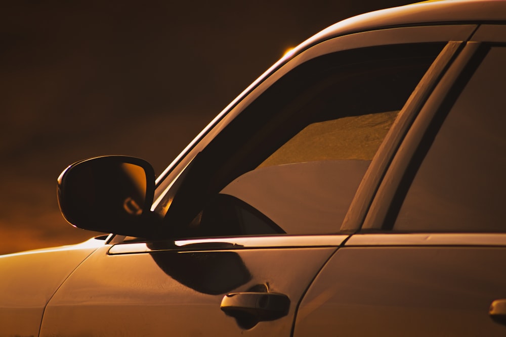 black car side mirror during night time