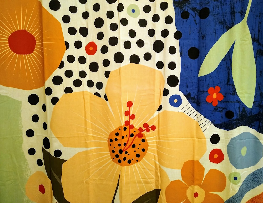 white orange and blue floral textile