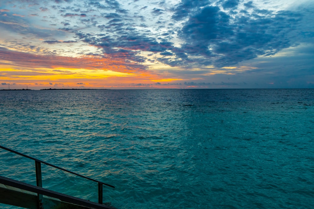 blue sea under blue sky during sunset