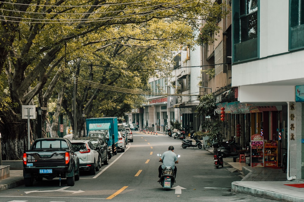 cars on road near buildings during daytime