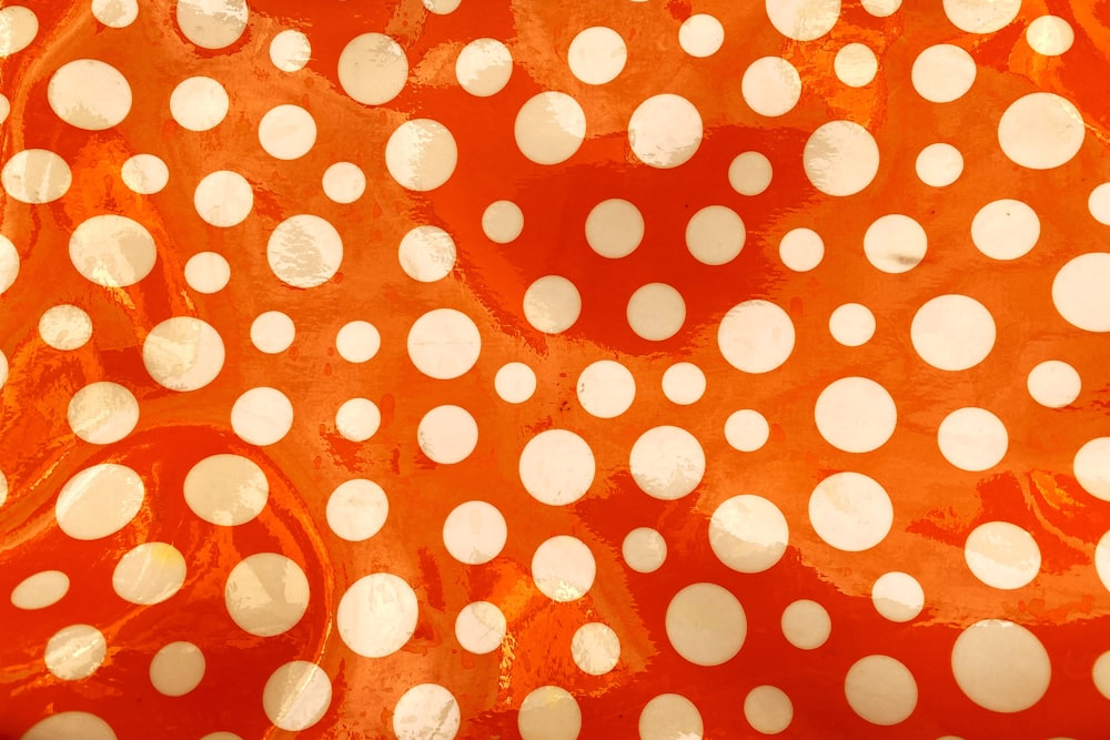 red and white polka dot textile