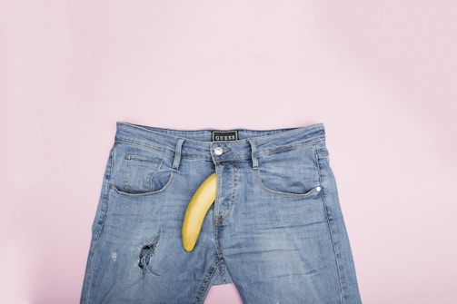 blue denim jeans with yellow banana on top