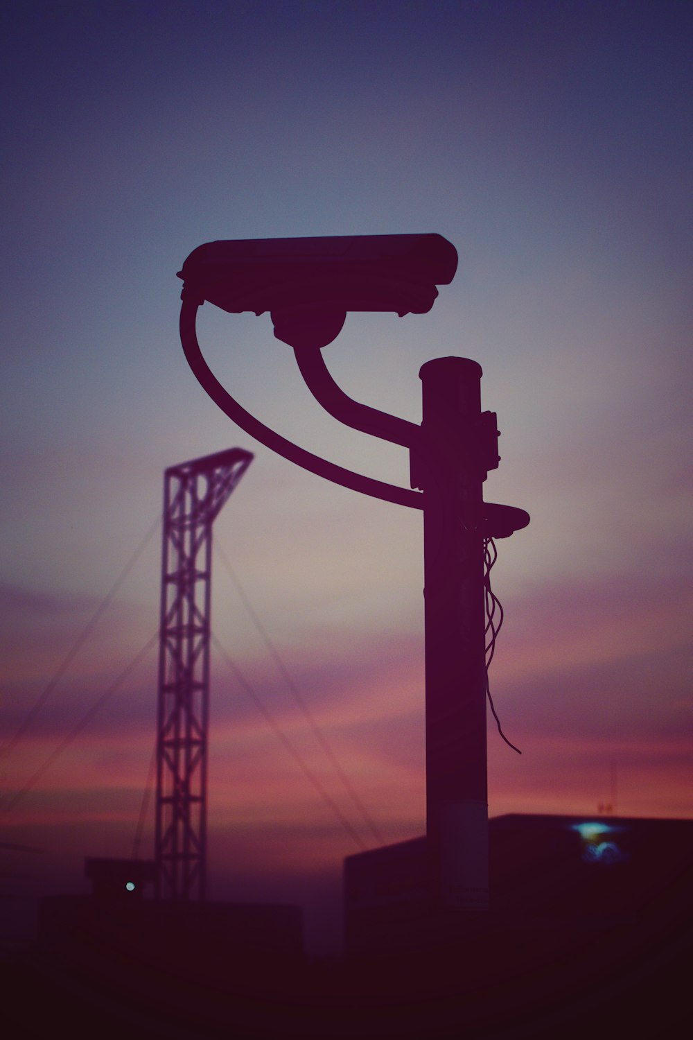 silhouette of metal tower during sunset