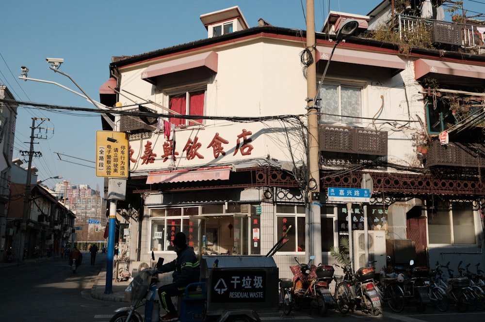 people sitting on chair near store during daytime