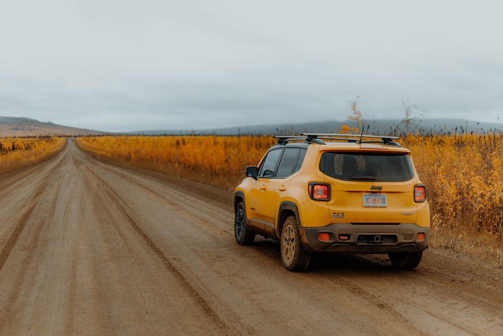 yellow car on road during daytime