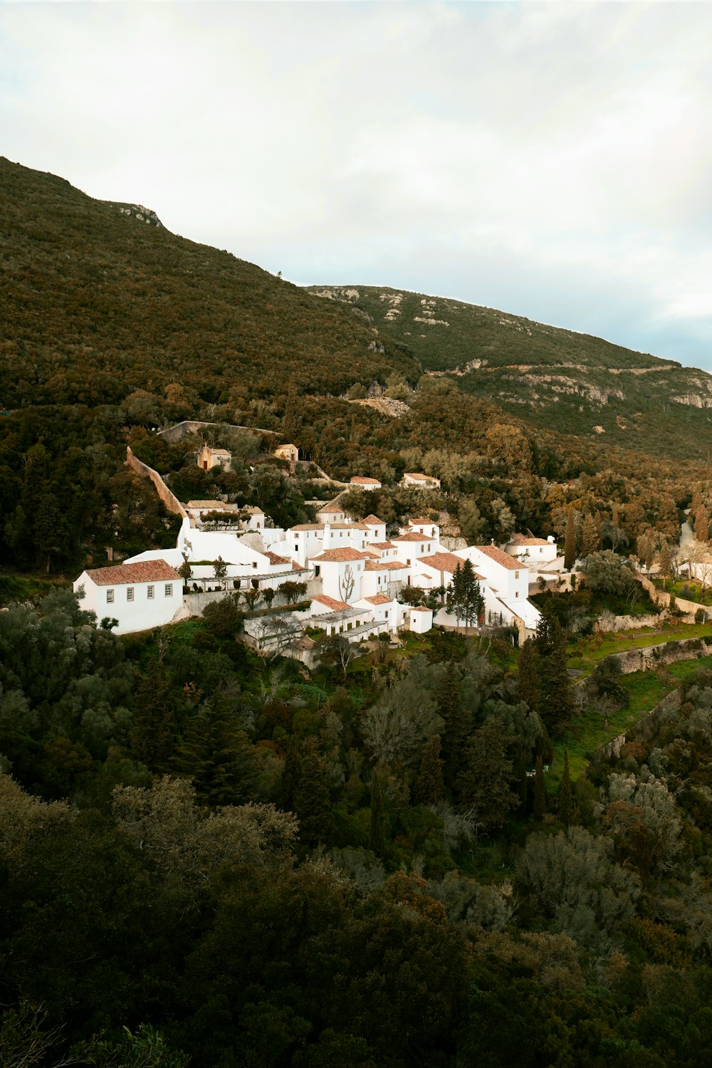 white concrete building on top of mountain during daytime