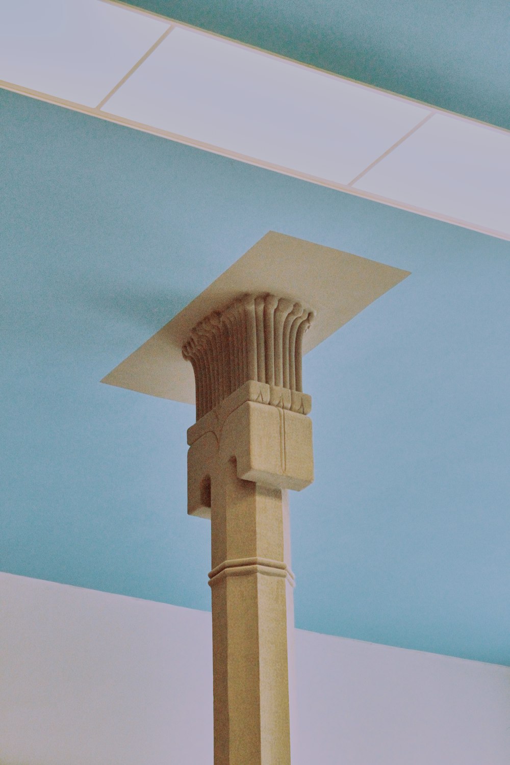 white concrete tower under blue sky during daytime