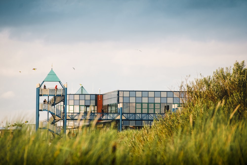 white and brown building near green grass field during daytime