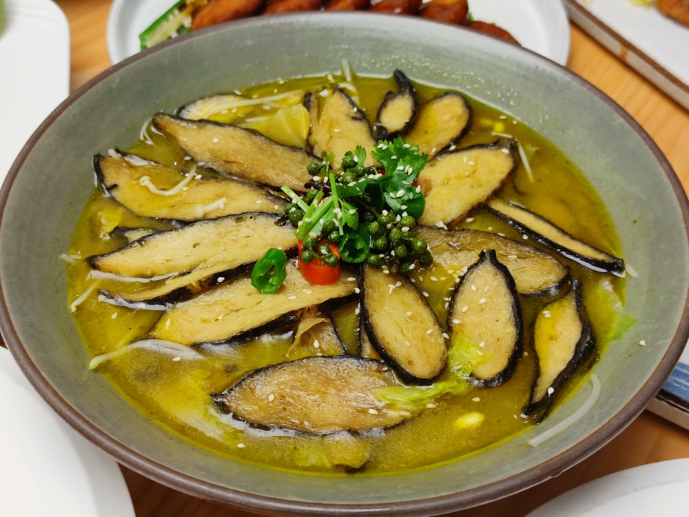 sliced cucumber on stainless steel bowl