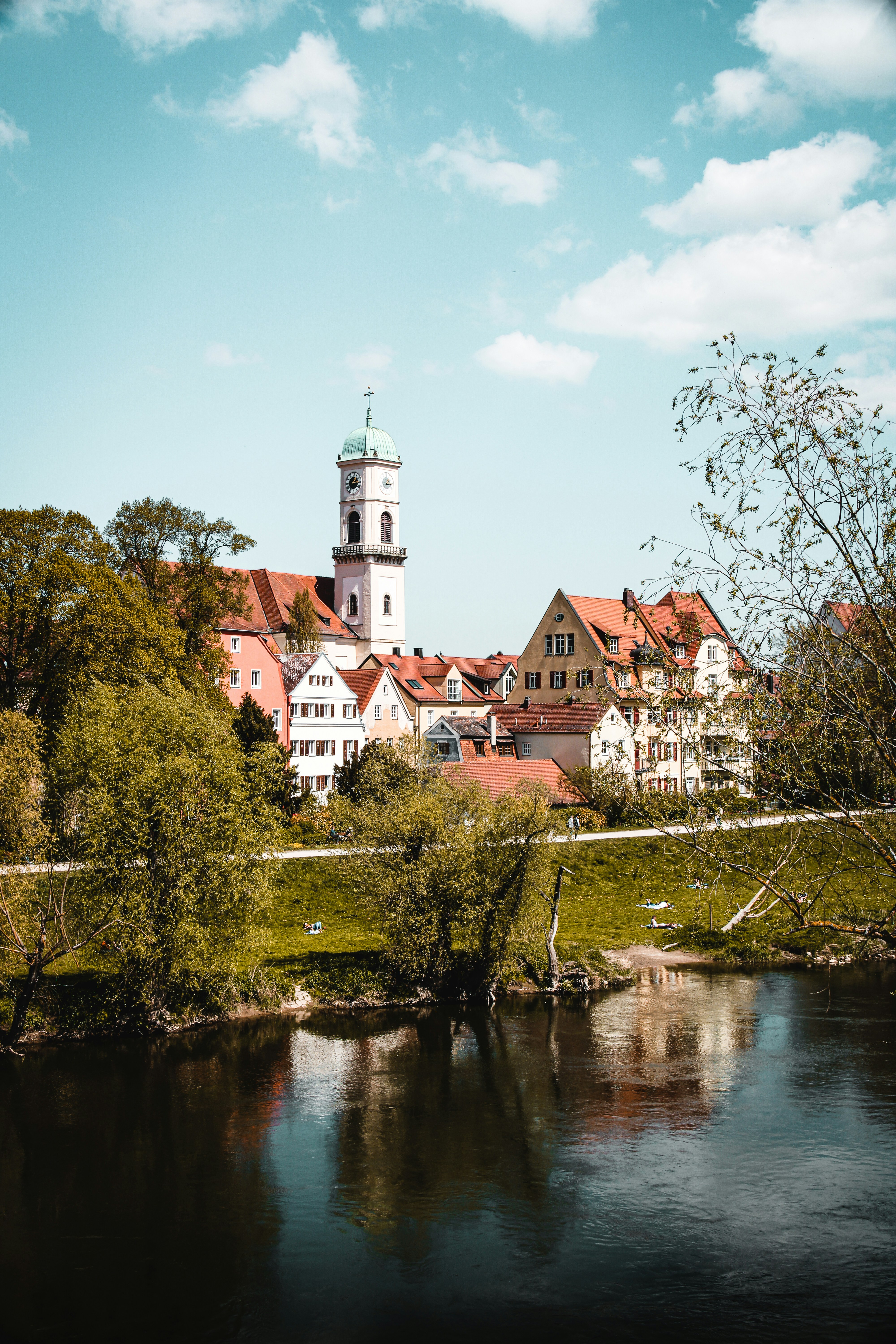 a river running through a lush green countryside