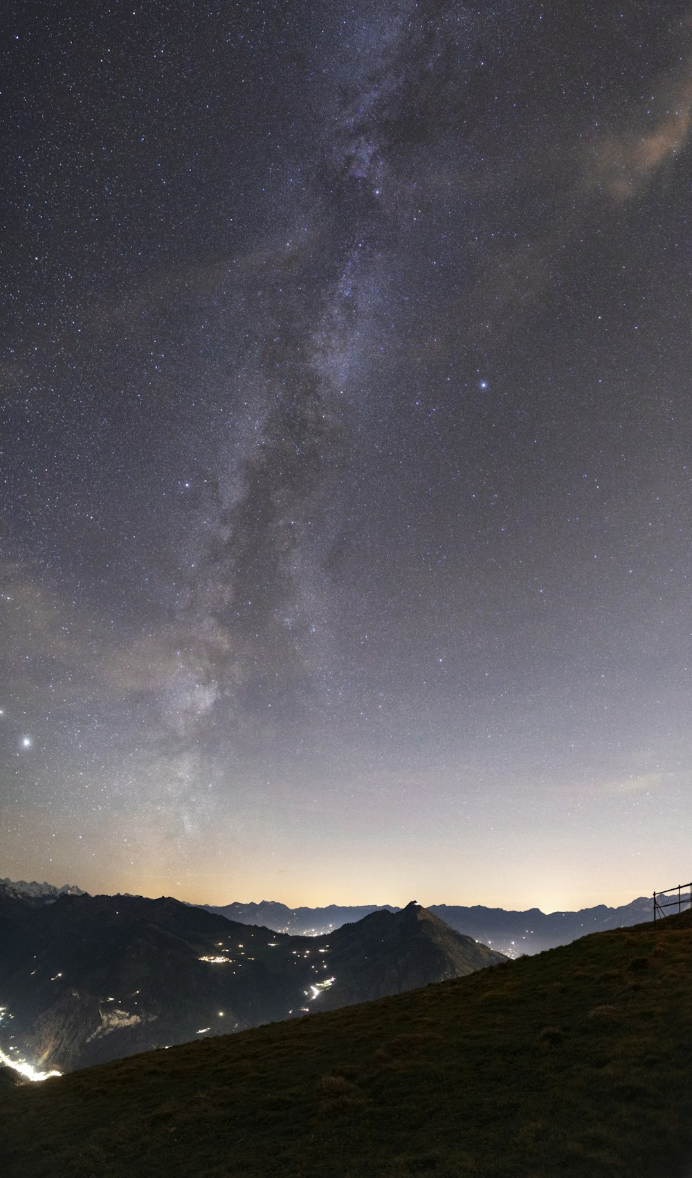 silhouette of mountain under starry night