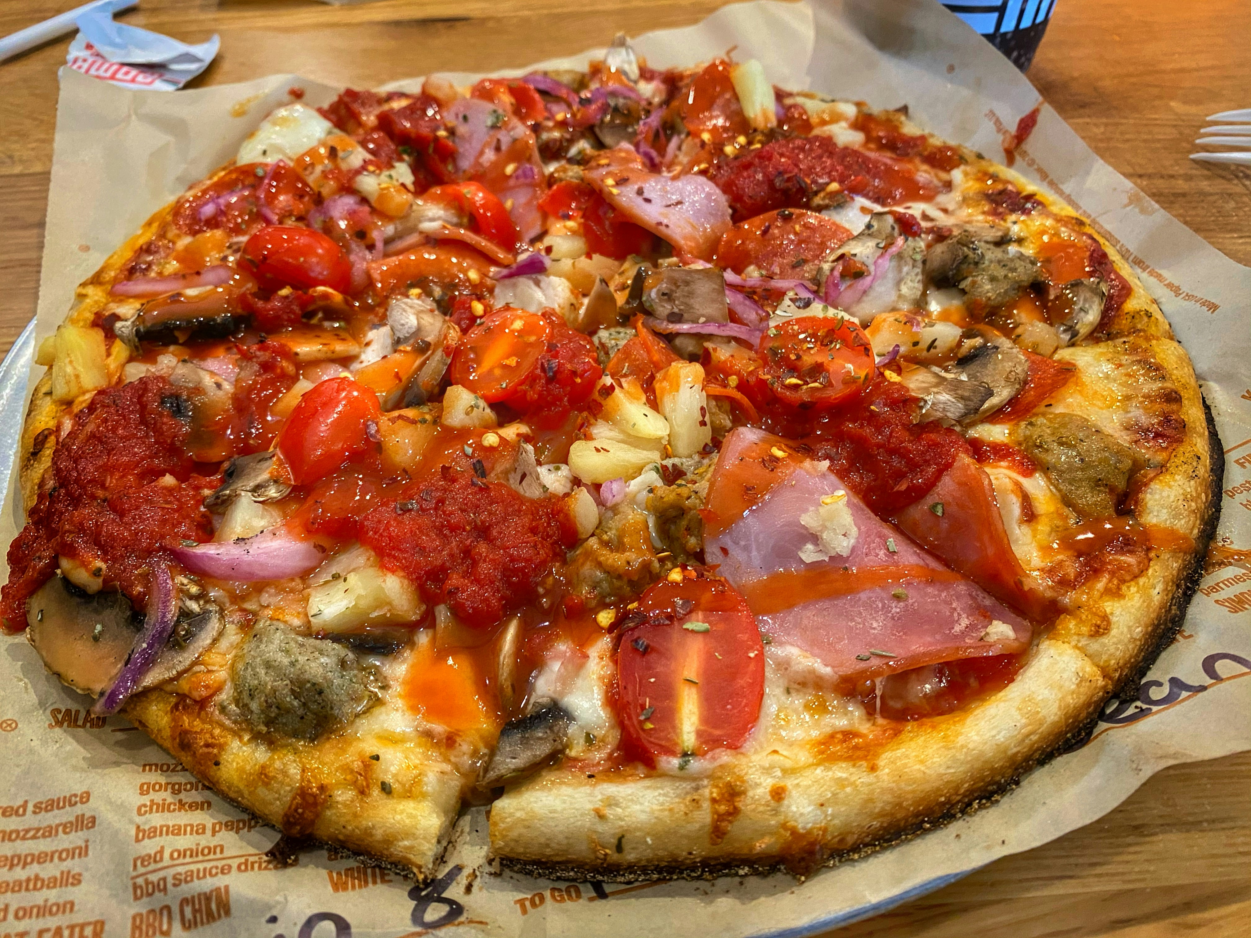 Shiva's Special Pizza — Chef's special loaded pizza, Indian café food photography with warm colours and appetising presentation