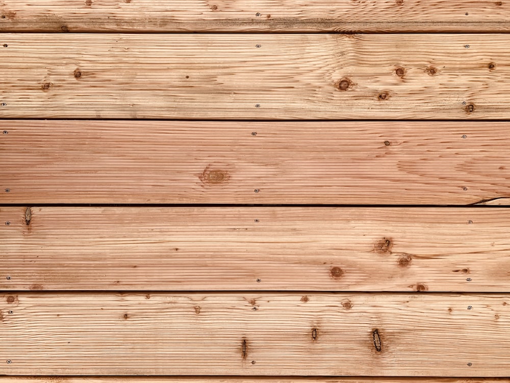 brown wooden plank with white and black paint