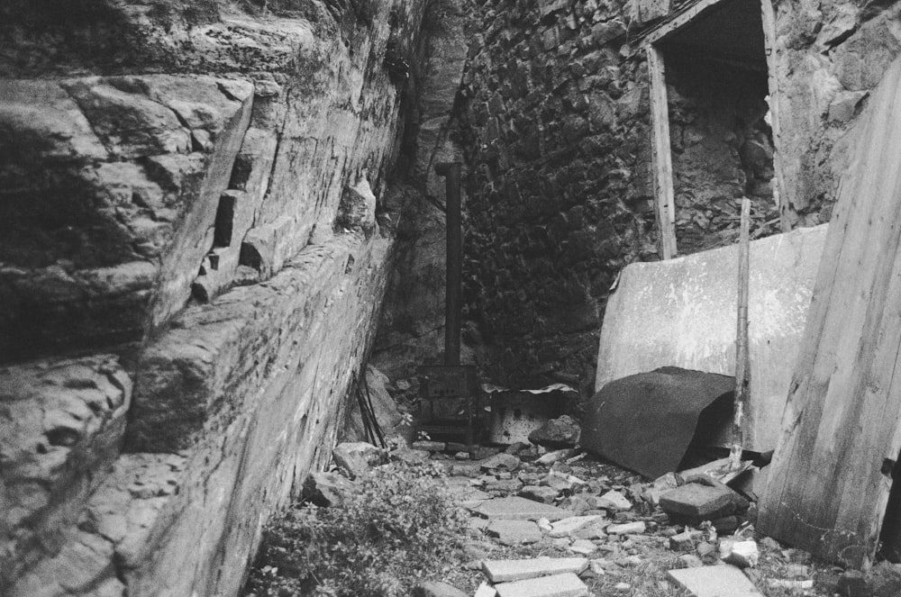 grayscale photo of concrete brick wall