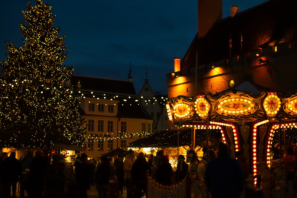 people walking on street during night time