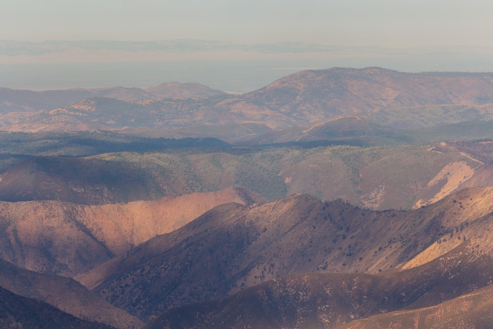 brown mountains under blue sky during daytime