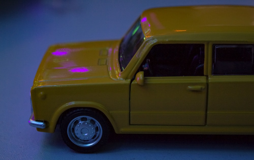 yellow car with purple lights