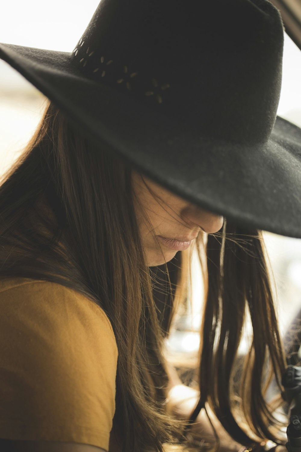 woman in black hat and black tank top