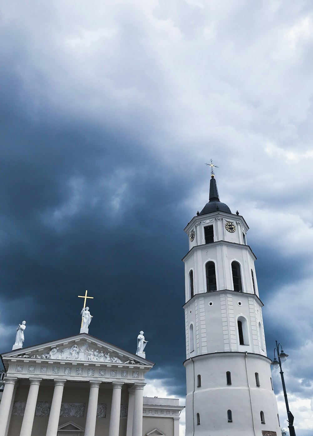 white and black church under blue sky