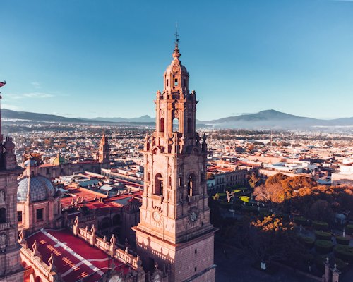 Brown and white concrete building during daytime — Morelia, Mexico