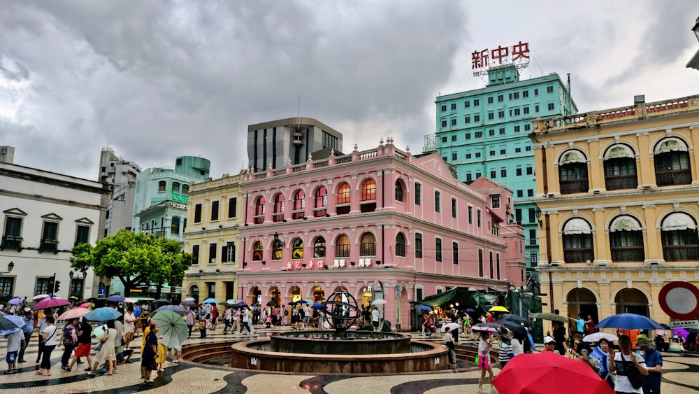 people walking on street near brown concrete building during daytime