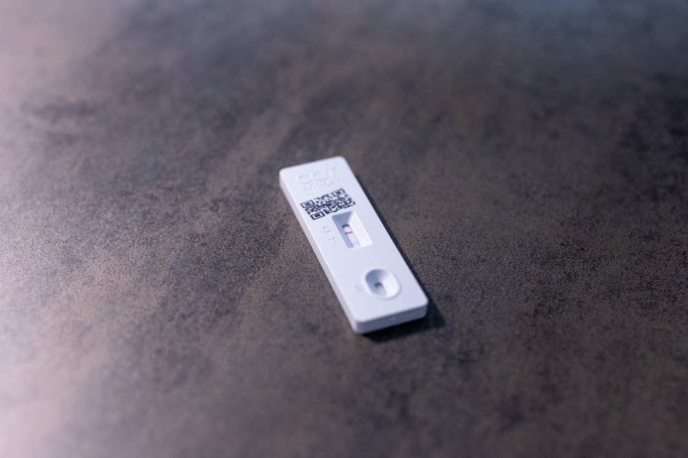 white usb flash drive on brown surface