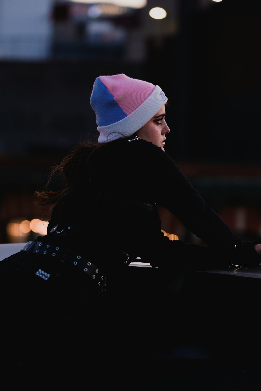 woman in black long sleeve shirt and white knit cap