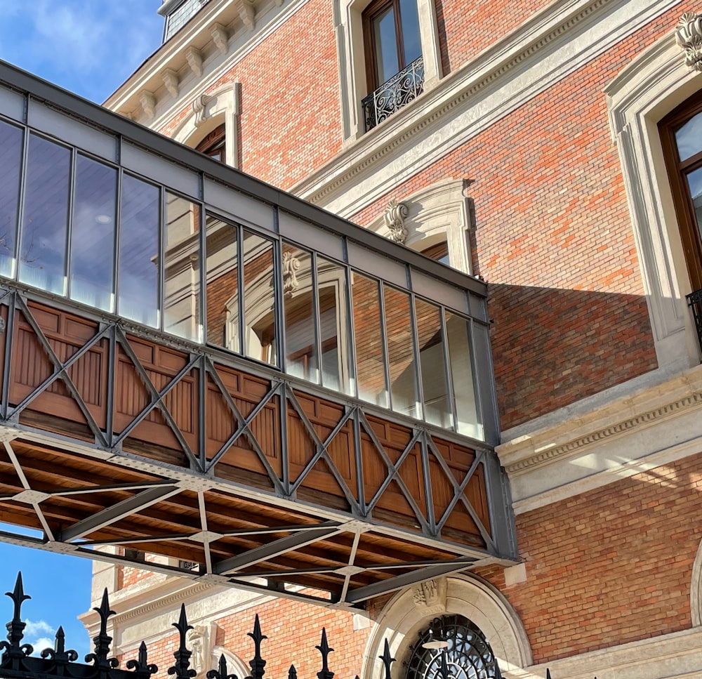 people walking on stairs near brown brick building during daytime