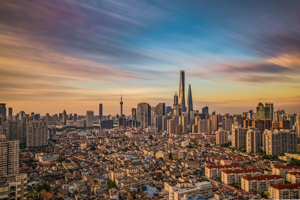 city skyline under blue sky during daytime