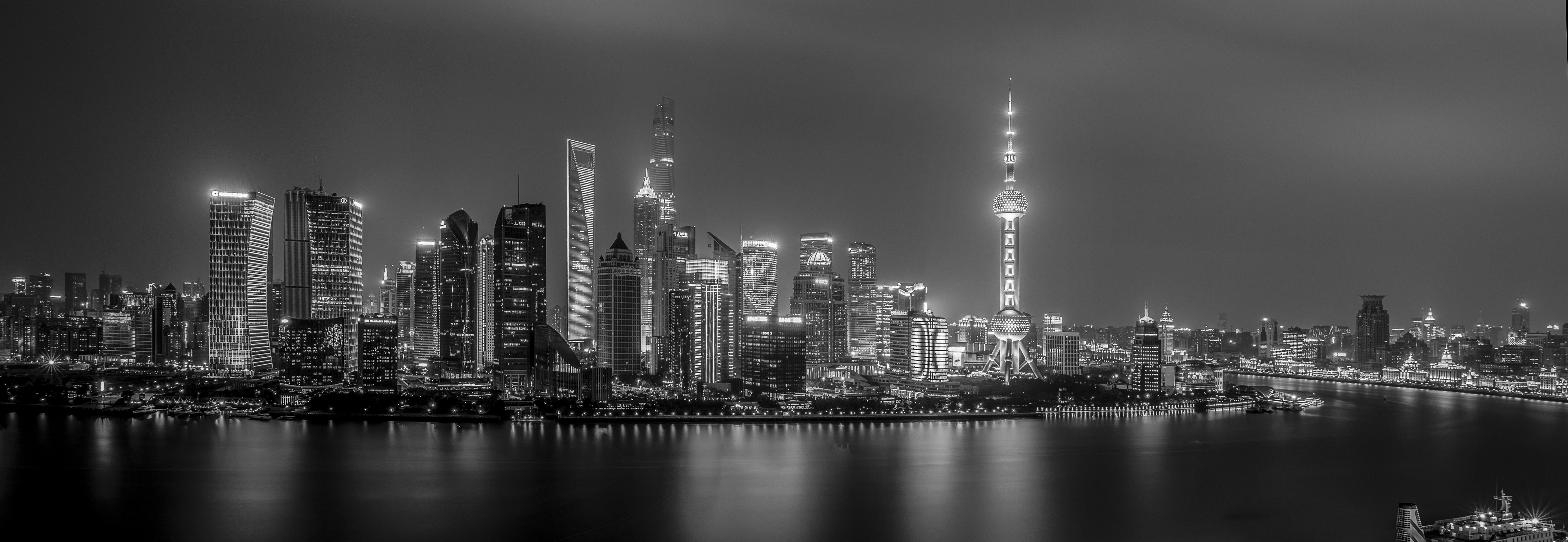grayscale photo of city skyline during night time