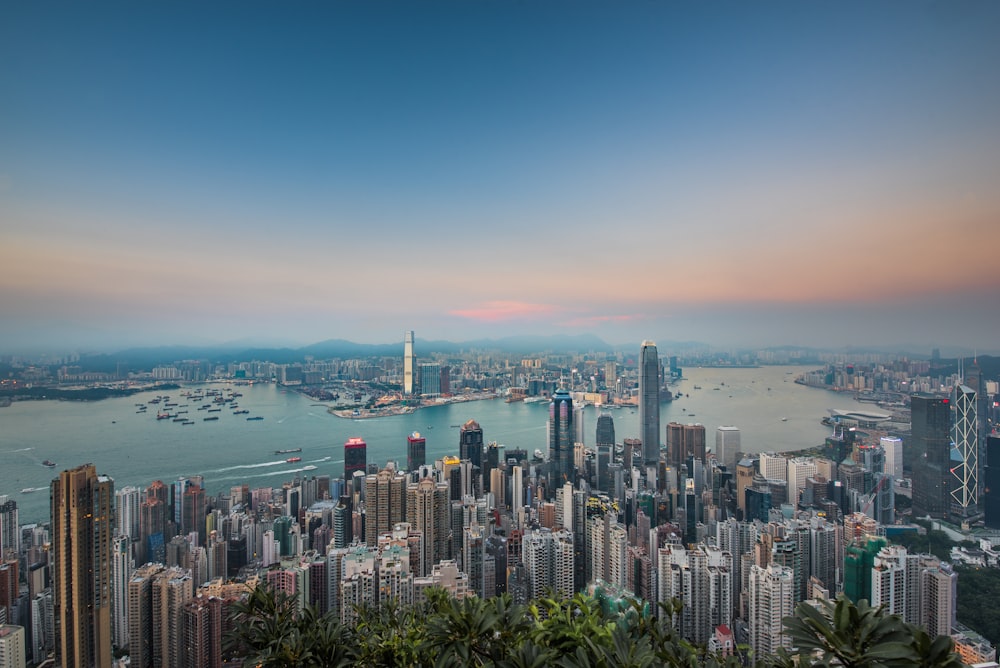 city skyline near body of water during daytime