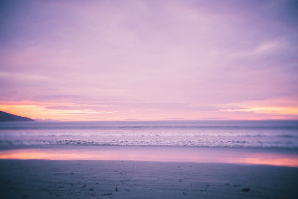 ocean under cloudy sky during daytime