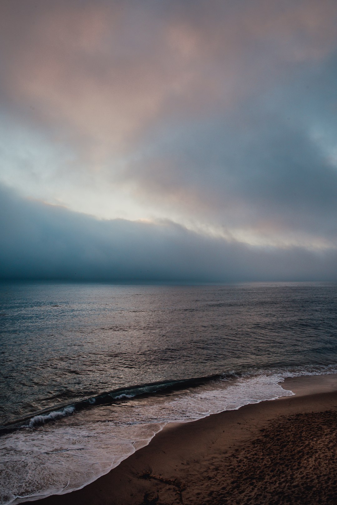 ocean under cloudy sky during daytime