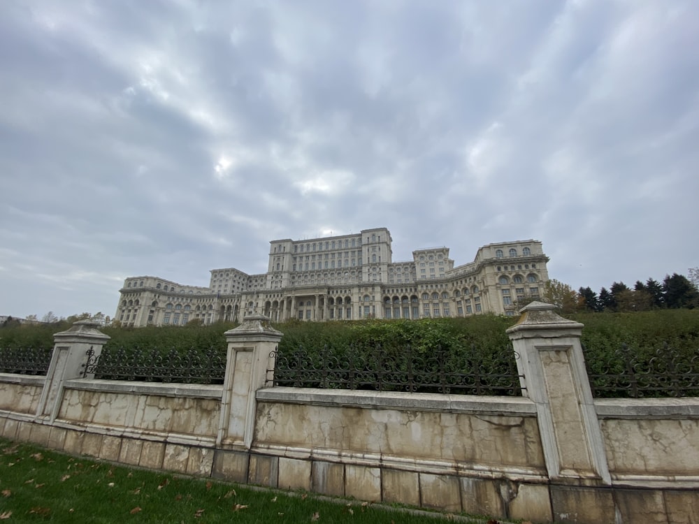 gray concrete building under white clouds during daytime