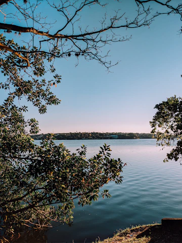 A serene view of Bauer Lakes with clear water reflecting the sky, symbolizing purity and success.