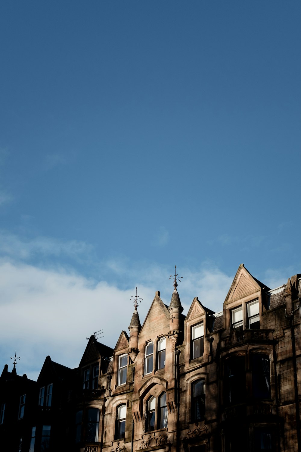 brown concrete building under blue sky during daytime