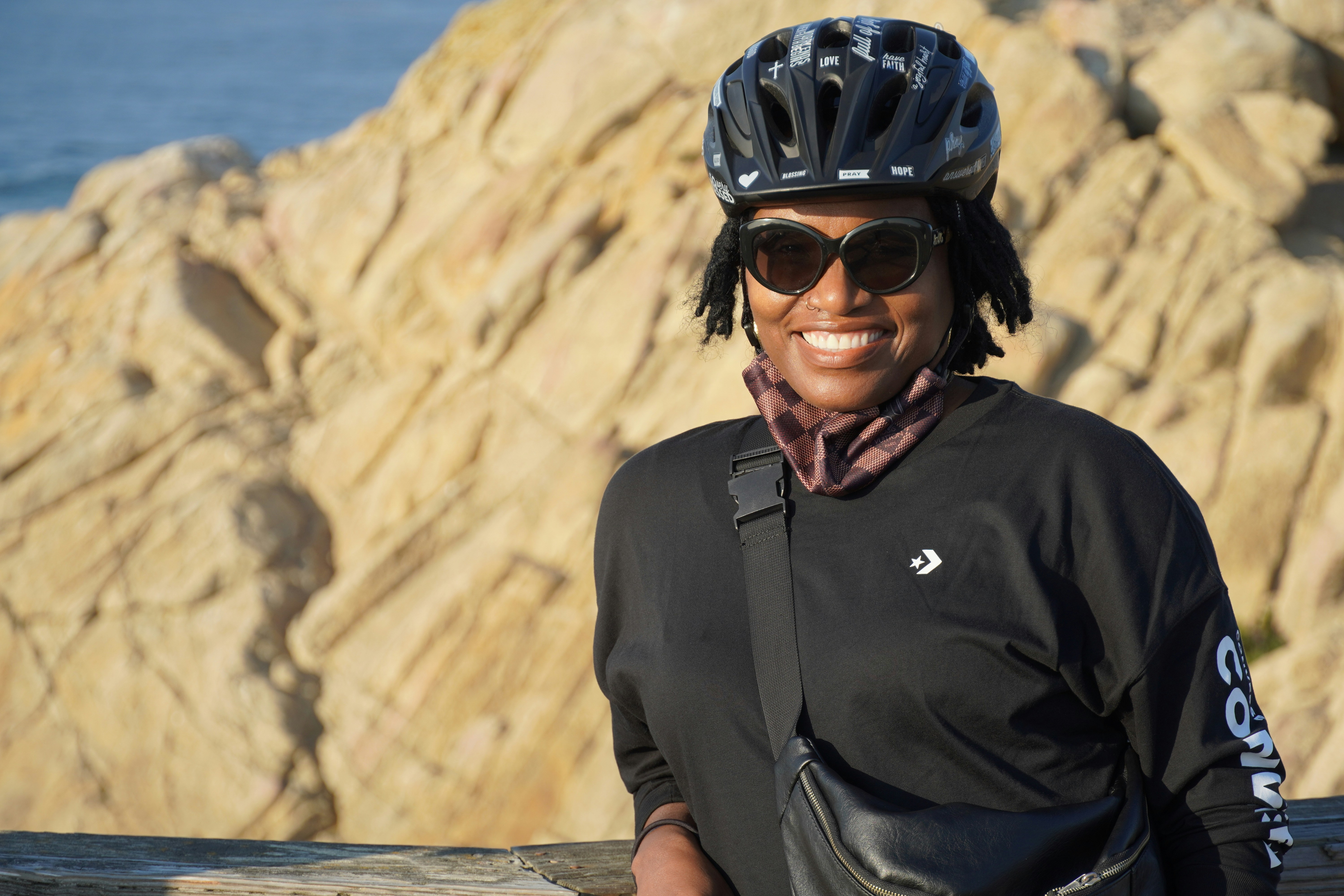 man in black polo shirt wearing black helmet