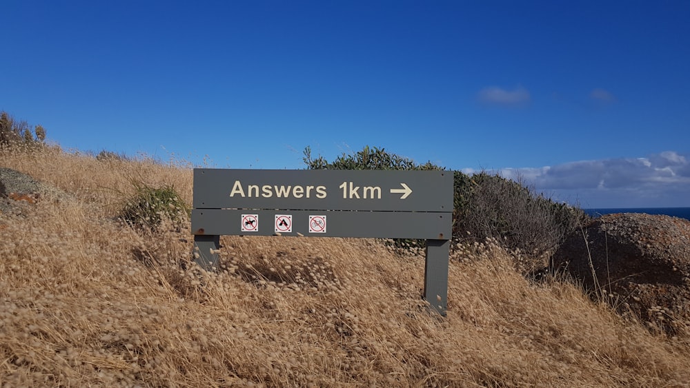 a sign that is on the side of a hill