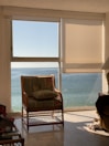 A cozy corner of the ocean view room with plush seating.