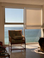 A calm therapy room with a comfortable chair and soft natural light filtering through the window.