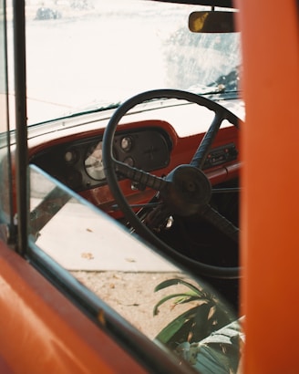 black steering wheel on orange car