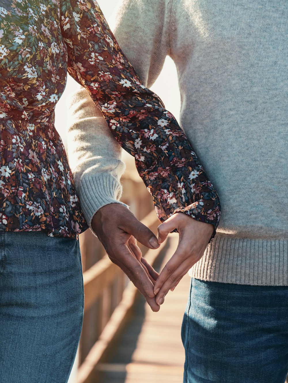 woman in red and white floral long sleeve shirt and blue denim jeans