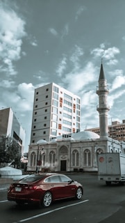 A scenic view of Mecca with a tow truck in the foreground.