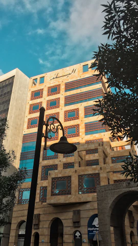 Exterior view of a stylish commercial building with elements inspired by Hawa Mahal architecture.