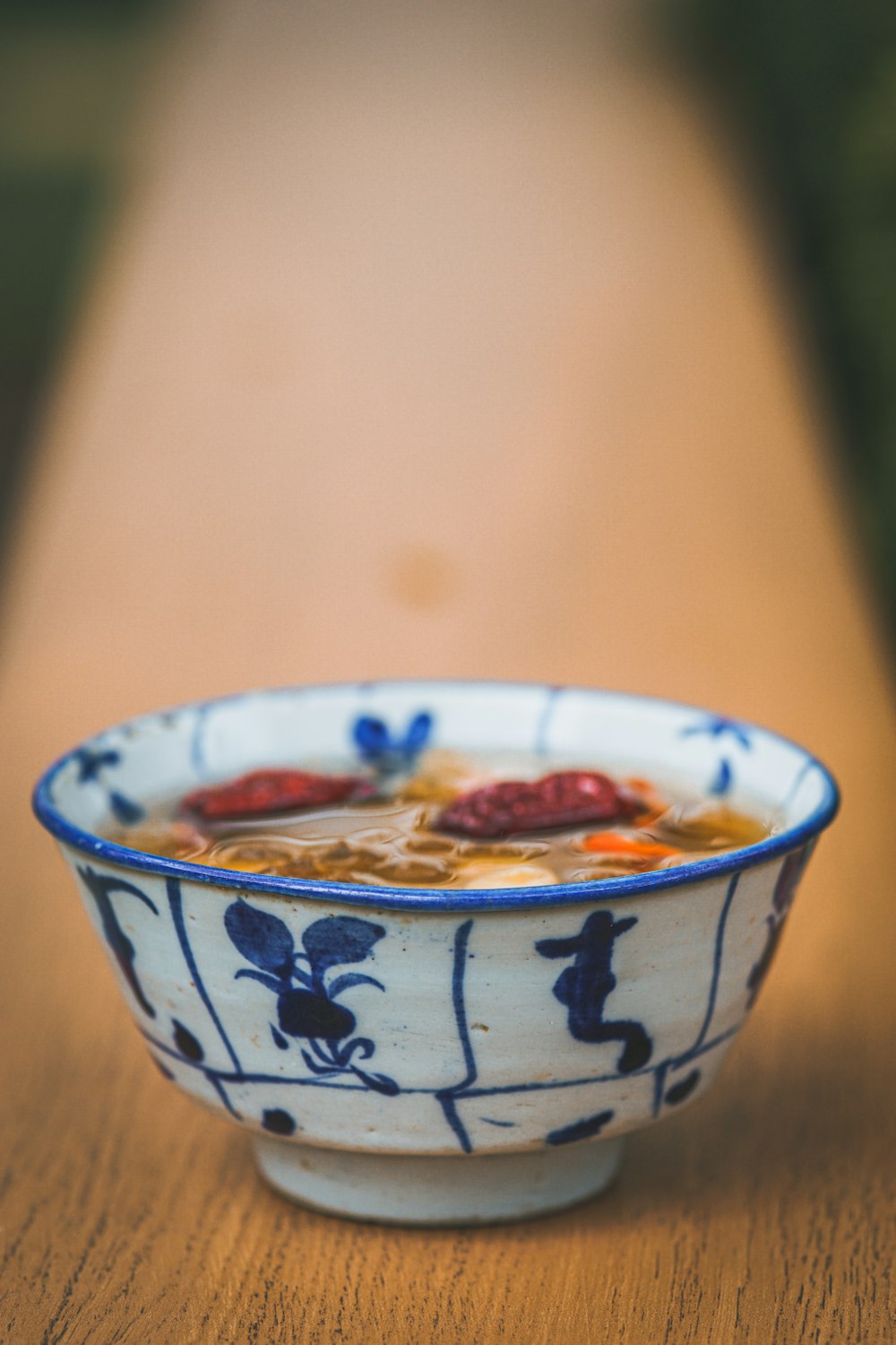 white and blue ceramic bowl