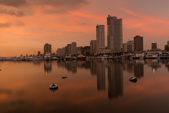 Sunset view of sleek Brickell high-rise condos with shimmering bay waters.