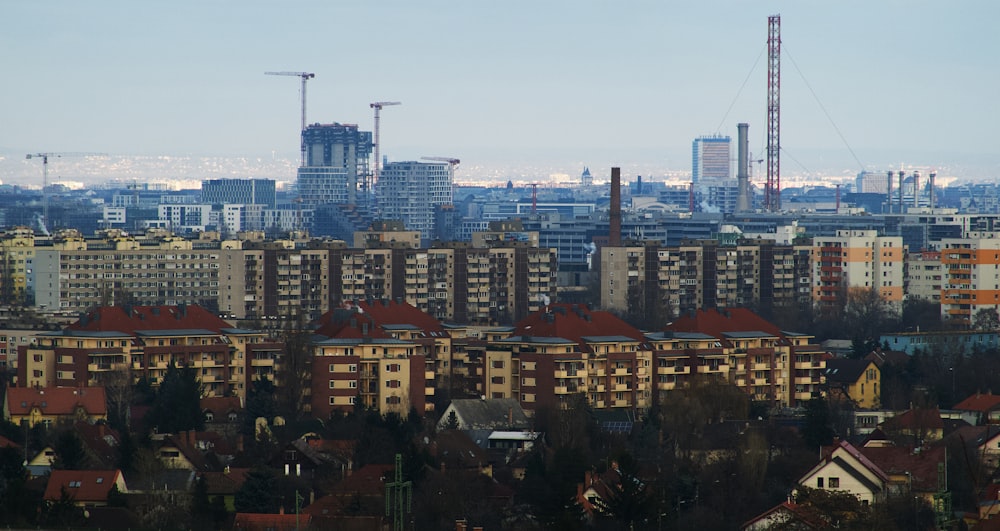 city with high rise buildings under gray sky during daytime